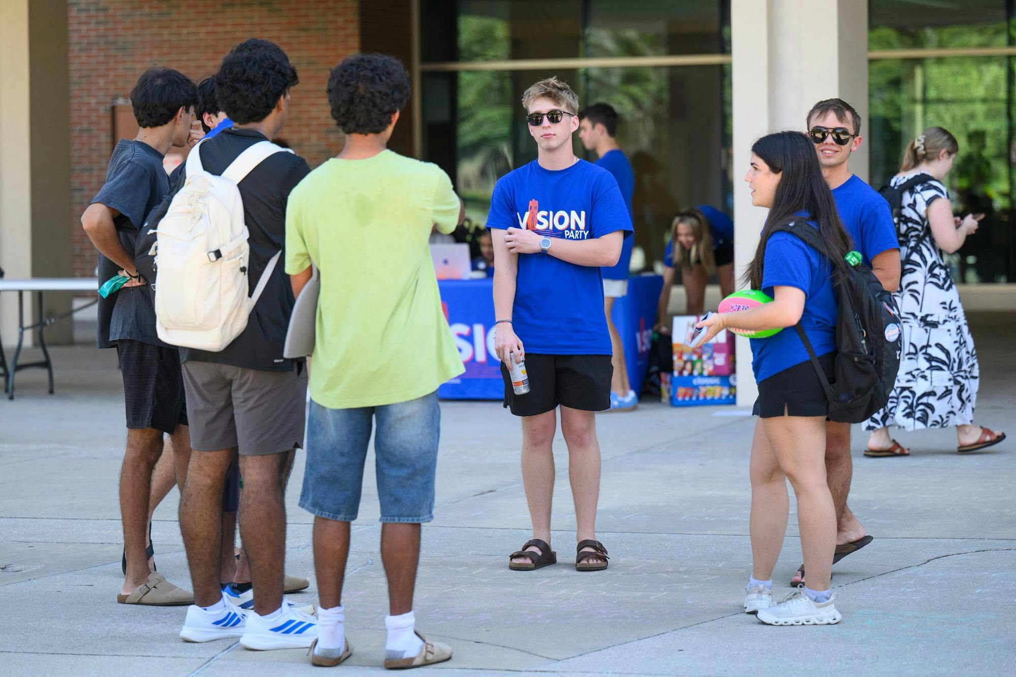 Vision Party volunteers talk with students outside the Reitz Union on student government election day, Wednesday, Sept. 30, 2026, in Gainesville, Fla.