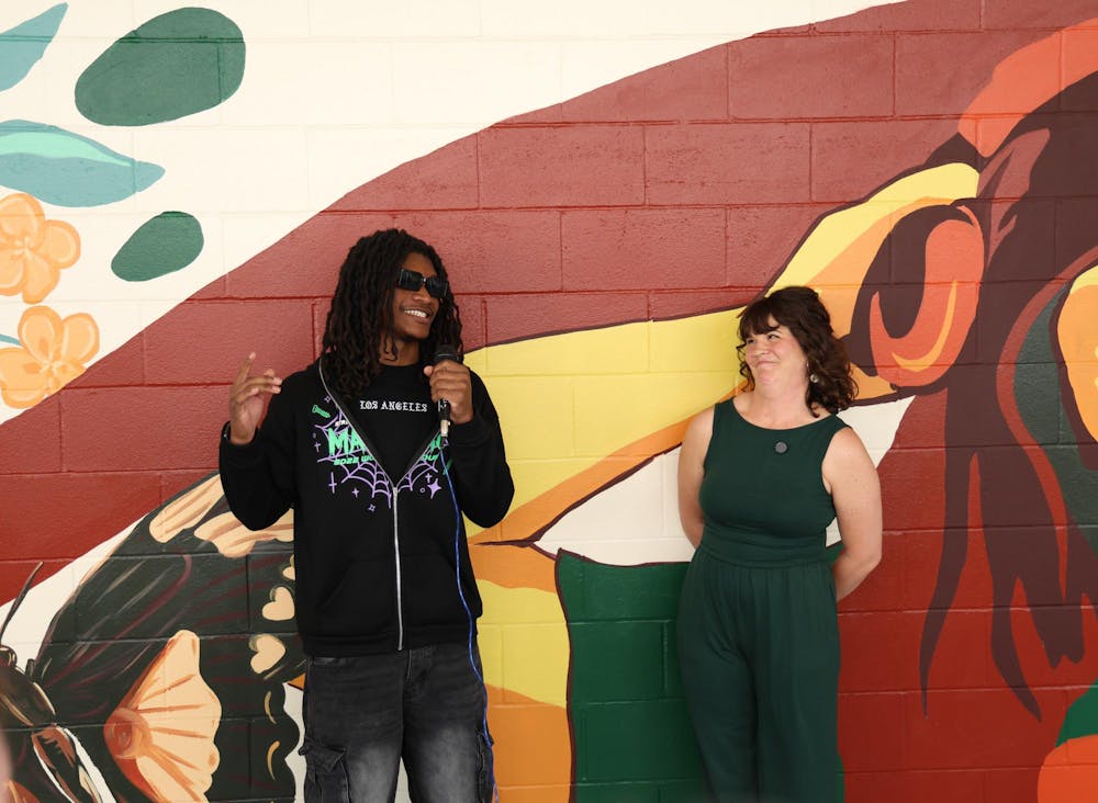 Kaleb Gordon shares his experience helping Jenna Horner with this mural at Eastside High School, Tuesday, March 31, 2026, in Gainesville, Fla.