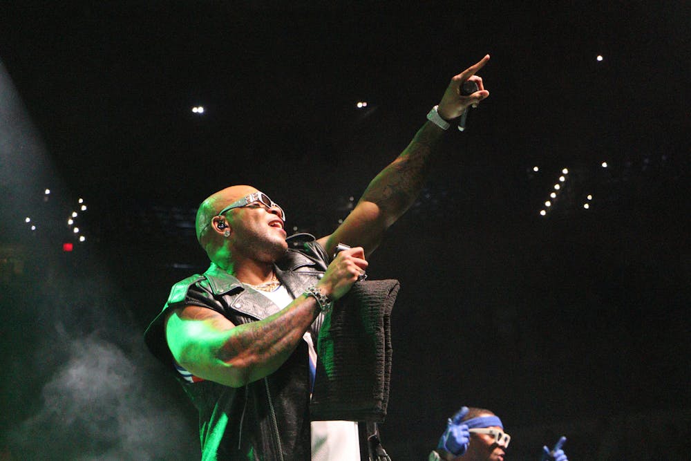 <p>Flo Rida hypes up the crowd at Gator Growl at the Stephen O&#x27;Connell Center Friday, Oct 7, 2022.</p>