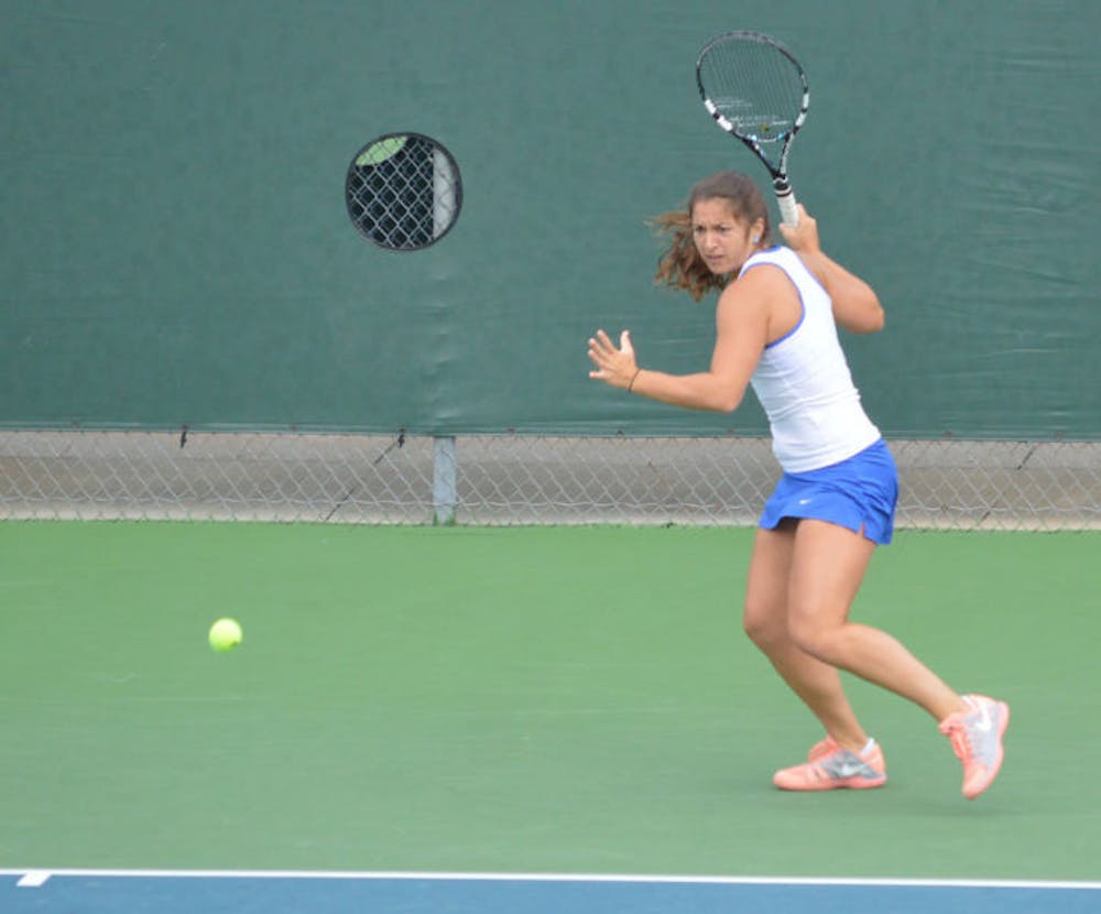 <p>Alex Cercone prepares for a forehand during Florida’s 4-0 win against Louisville on Jan. 25. Cercone clinched Florida's 4-1 win against Oklahoma State in the second round of the NCAA Tournament on Saturday.</p>