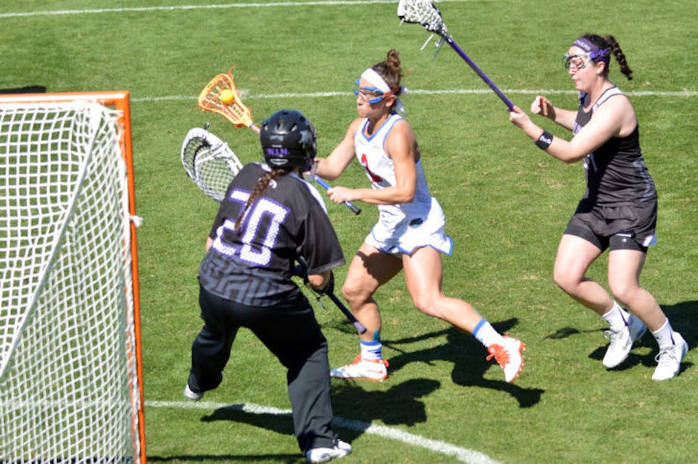 <p>Sammi Burgess attempts a shot during Florida's 18-7 win against High Point on Feb. 15 at Donald R. Dizney Stadium. Burgess, the ALC Rookie of the Week, scored a career-high four goals against Vanderbilt on Sunday.</p>