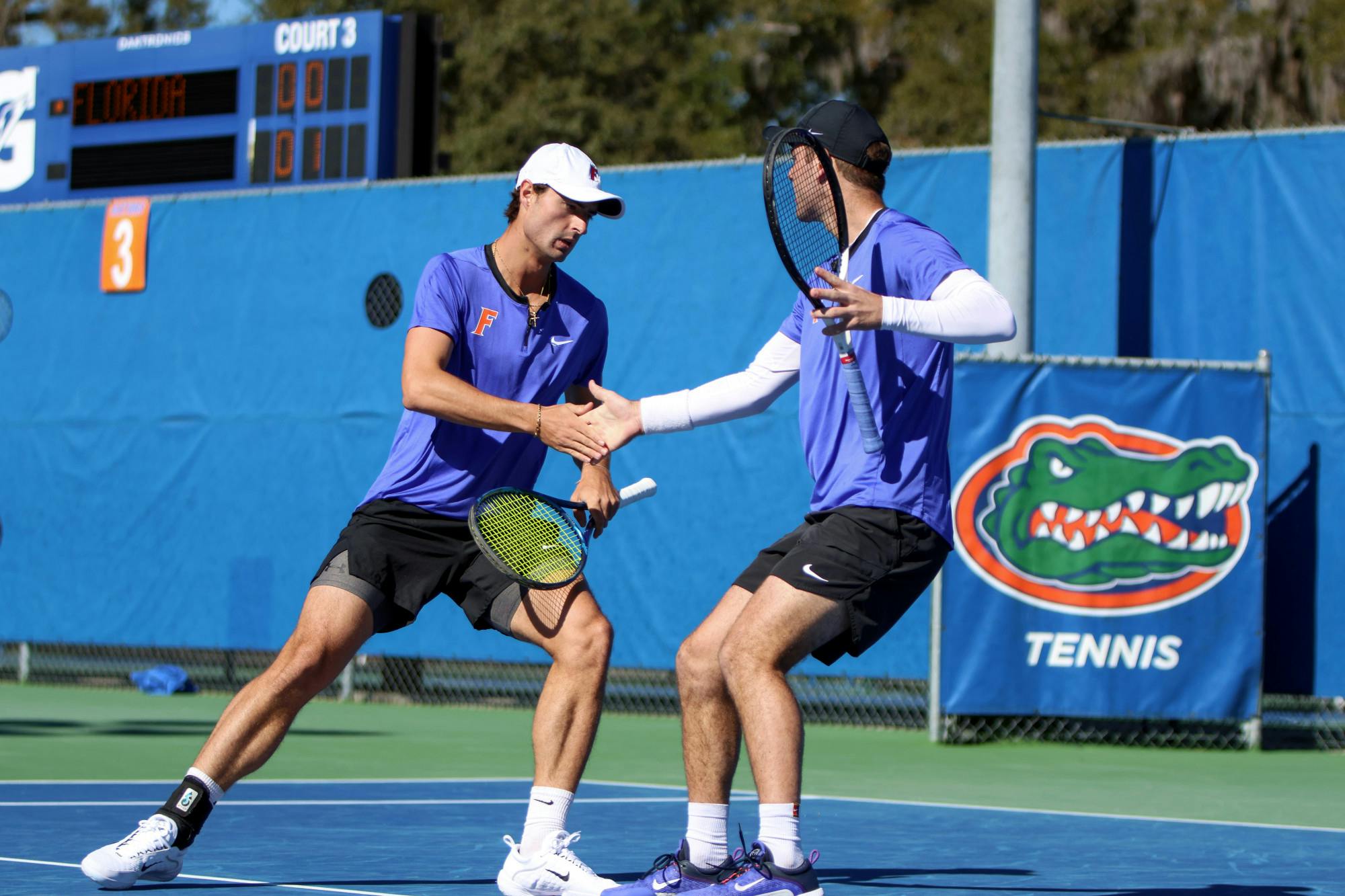 Gators Axel Nefve (left) and Will Grant (right) share the court in their doubles match during Florida’s 5-2 loss to Texas Sunday, Jan. 15, 2023. Nefve and Grant lost to the No. 7-ranked pair of Longhorns Cleeve Harper and Eliot Spizzirri.