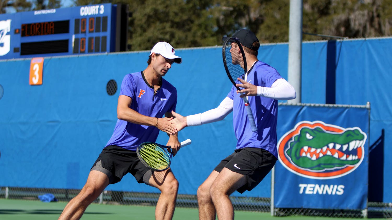 Gators Axel Nefve (left) and Will Grant (right) share the court in their doubles match during Florida’s 5-2 loss to Texas Sunday, Jan. 15, 2023. Nefve and Grant lost to the No. 7-ranked pair of Longhorns Cleeve Harper and Eliot Spizzirri.