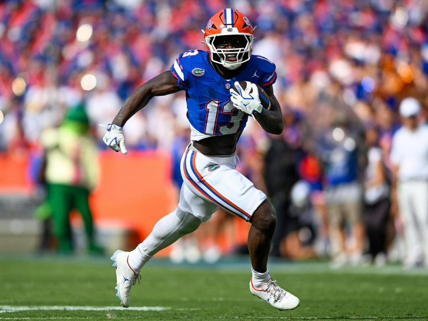 Florida Gators running back Jadan Baugh (13) runs with the ball during a football game between the Texas Longhorns and the Florida Gators on Saturday, Oct. 4th, 2025, at Ben Hill Griffin Stadium in Gainesville, Fla.