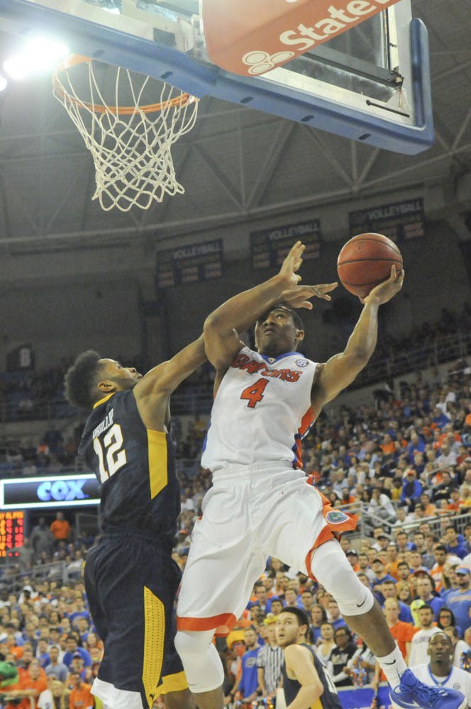 UF guard KeVaughn Allen goes up for a layup during Florida's 88-71 win over West Virginia on Jan. 30, 2016, in the O'Connell Center. 
