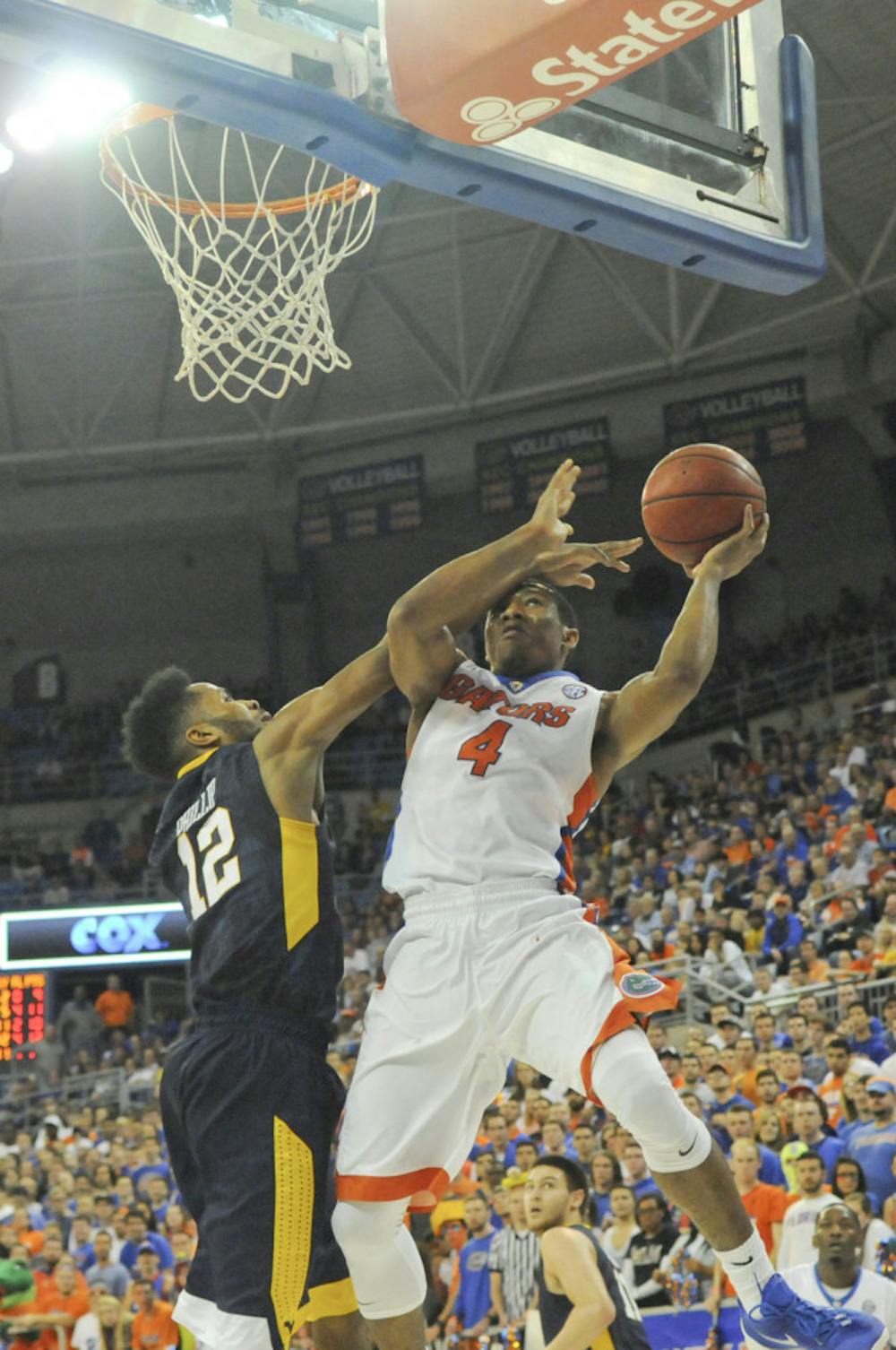 <p>UF guard KeVaughn Allen goes up for a layup during Florida's 88-71 win over West Virginia on Jan. 30, 2016, in the O'Connell Center. </p>