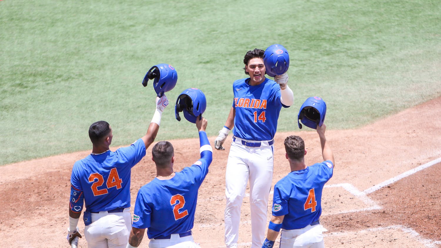 Florida sophomore two-way player celebrates with his teammates during the Gators' 8-2 win against Connecticut Sunday, June 4, 2022. 