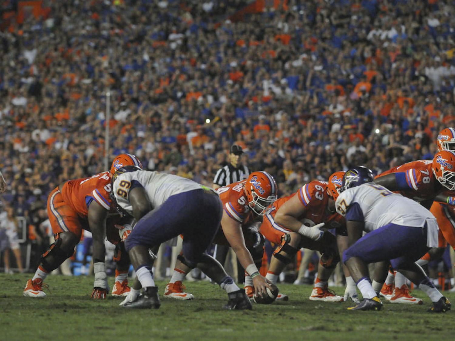 UF center Cam Dillard (54) prepares to hike the ball during Florida's 31-24 win against East Carolina on Sept. 12, 2015, at Ben Hill Griffin Stadium.
