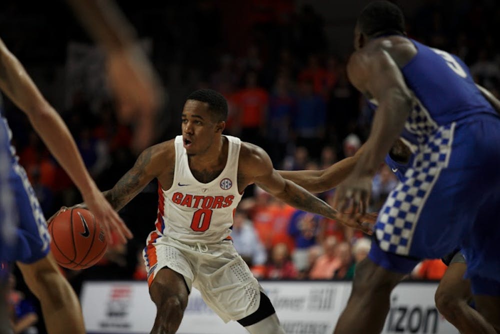 <p>UF guard Kasey Hill dribbles the basketball during Florida's 88-66 win over Kentucky on Feb. 5, 2017, in the O'Connell Center.</p>