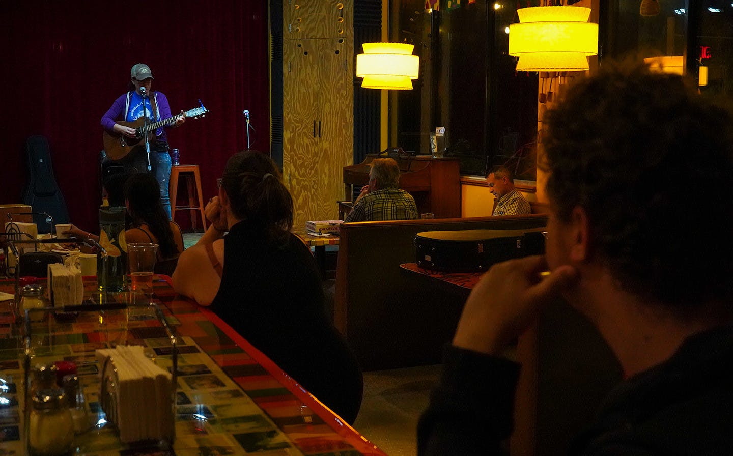 K.D. Eno performs for the patrons of Lightnin Salvage Enterprise at open mic night on Wednesday, Feb. 5, 2025.