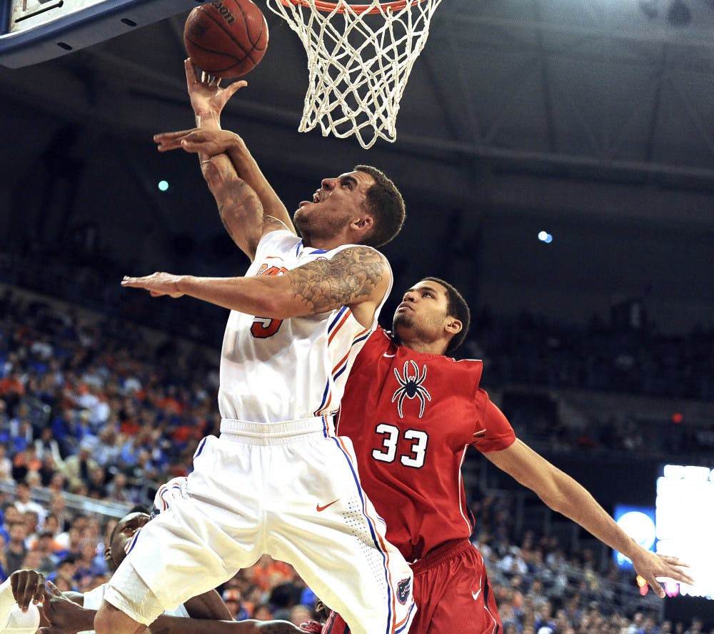 <p>Florida point guard Scottie Wilbekin (5) attempts a layup against Richmond on Jan. 4. Wilbekin tied his career high with 18 points Saturday against Arkansas, including eight from the free throw line.</p>