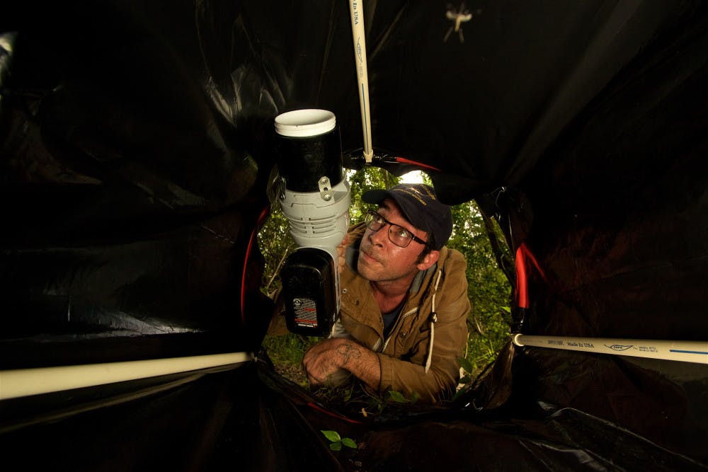 <p>Lawrence E. Reeves, 35, spent a little more than a year in a controlled studying the DNA of Florida mosquitoes to see if they bit invasive Burmese pythons. He’s now a postdoctoral researcher at UF’s Institute of Food and Agricultural Sciences’ Florida Medical Entomology Lab in Vero Beach, Florida, where he is testing his research in the Everglades. </p>