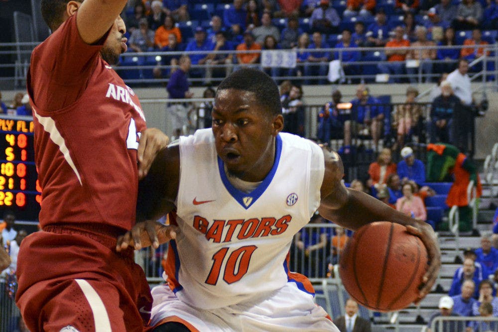 <p>Dorian Finney-Smith drives into the paint during Florida's 57-56 win against Arkansas on Saturday in the O'Connell Center.</p>