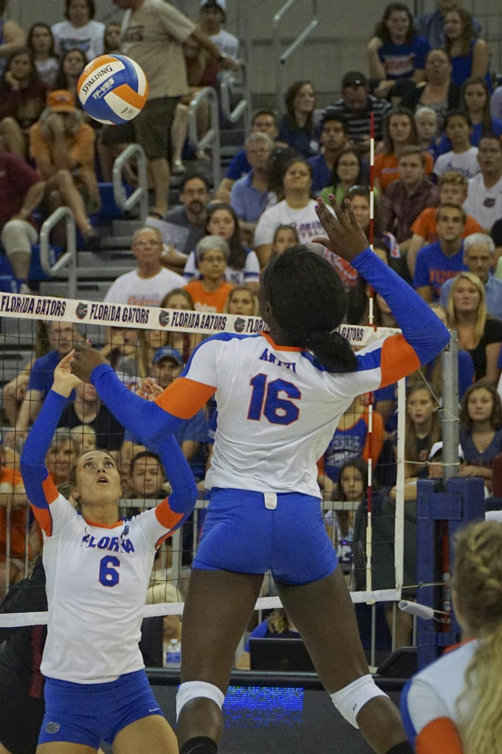 <p>UF setter Mackenzie Dagostino sets the ball for middle blocker Simone Antwi during Florida's 3-1 win against Florida State on Sept. 20, 2015, in the O'Connell Center.</p>