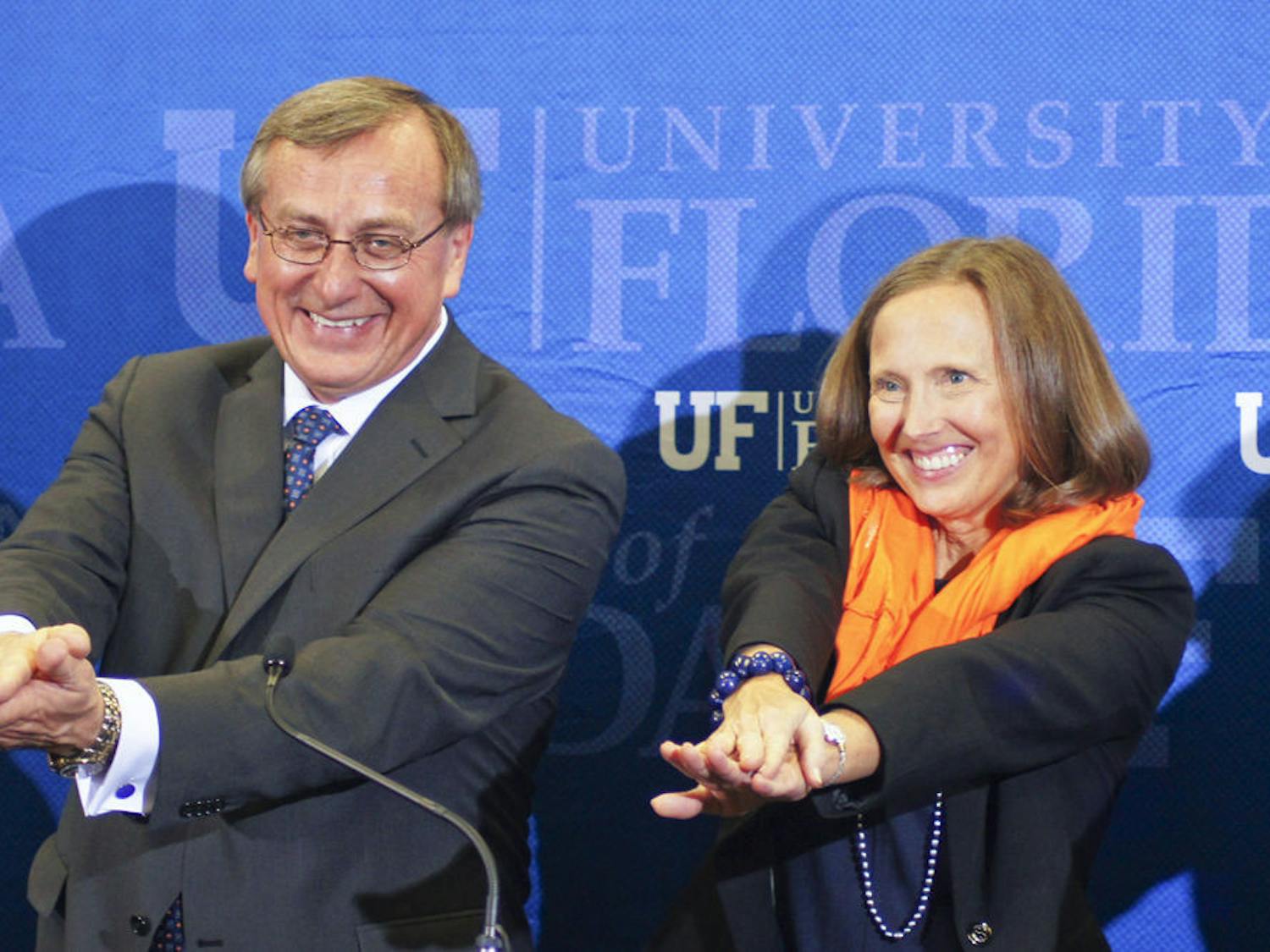 Kent Fuchs and his wife, Linda, Gator Chomp after the Cornell University provost was named UF’s 12th president at Emerson Alumni Hall on Wednesday.