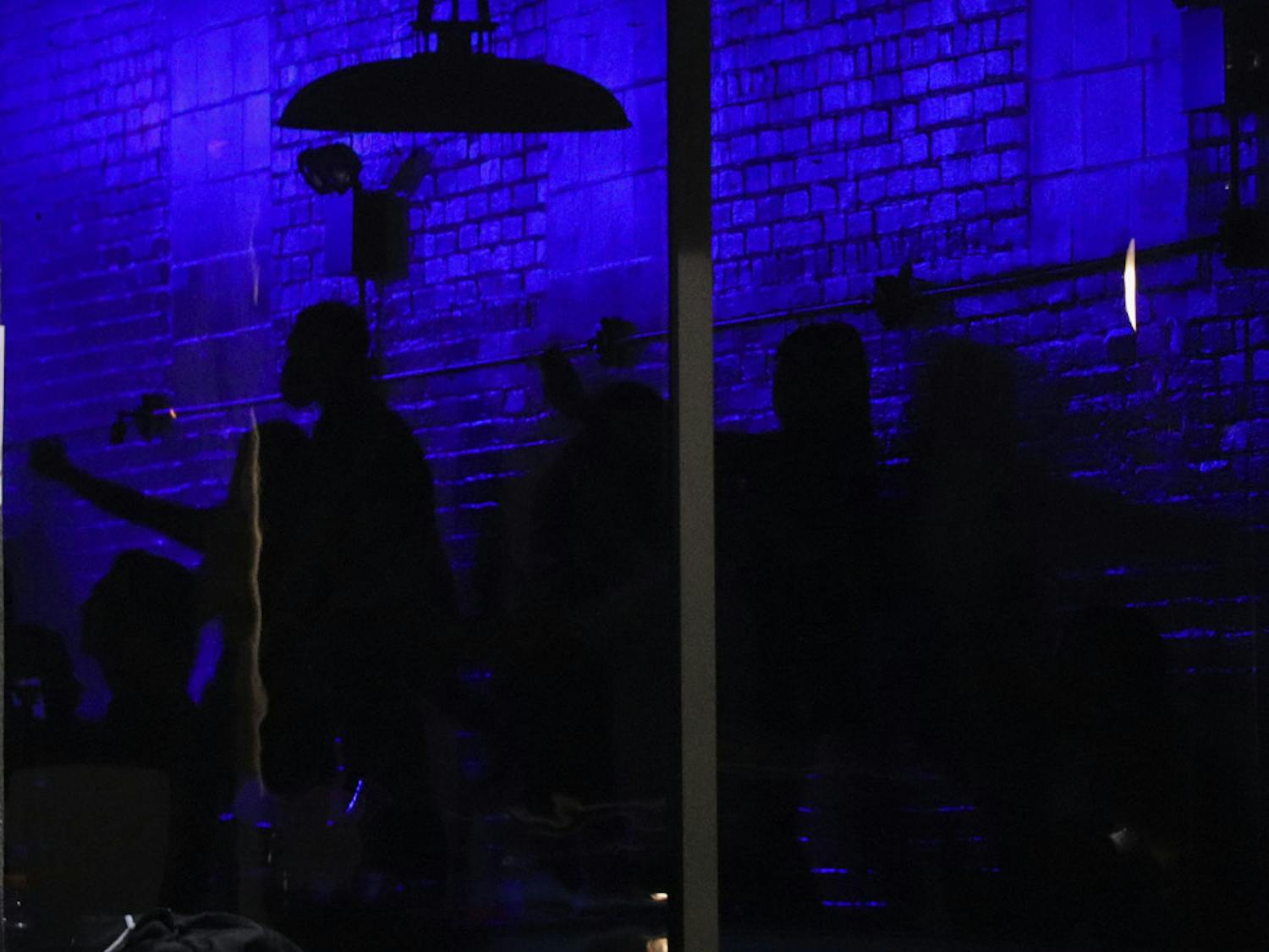 People are seen dancing inside of The Range, located off of 2nd Avenue in Downtown Gainesville on Saturday night, after the first home football game of the season. (Chasity Maynard/Alligator Staff)