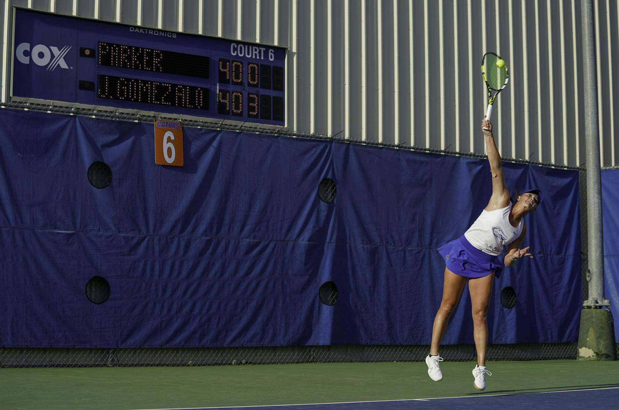 Reagan Parker strikes the ball at her opponent at Alfred A. Ring Tennis Complex on Friday, March 28, 2025. Jimena Gomez Alonso of University of Arkansas defeated Parker 6-3 and 6-0.