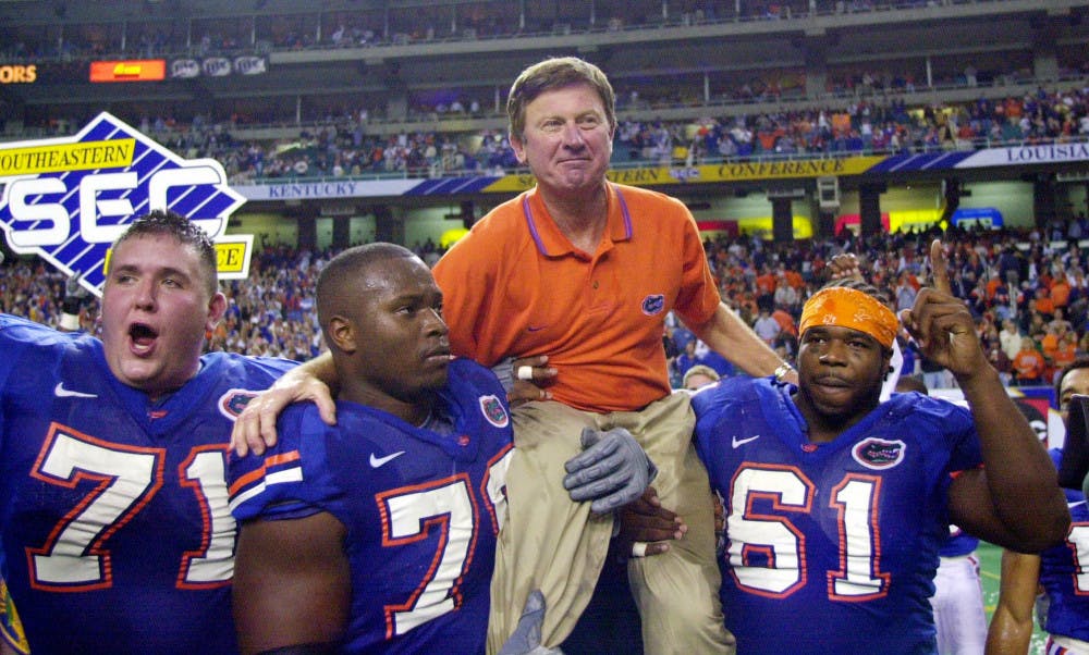 <p>FILE - In this Dec. 2, 2000, file photo, Florida head coach Steve Spurrier is carried off the field by Mike Pearson (71), Kenyatta Walker (78) and Gerard Warren (61) after the Gators downed Auburn 28-6 in the SEC Championship NCAA college football game at the Georgia Dome in Atlanta. Florida is renaming its football field after former coach Steve Spurrier. The university's board of trustees approved the change Thursday, June 9,2016, making it Steve Spurrier-Florida Field at Ben Hill Griffin Stadium. (AP Photo/John Bazemore, File)</p>