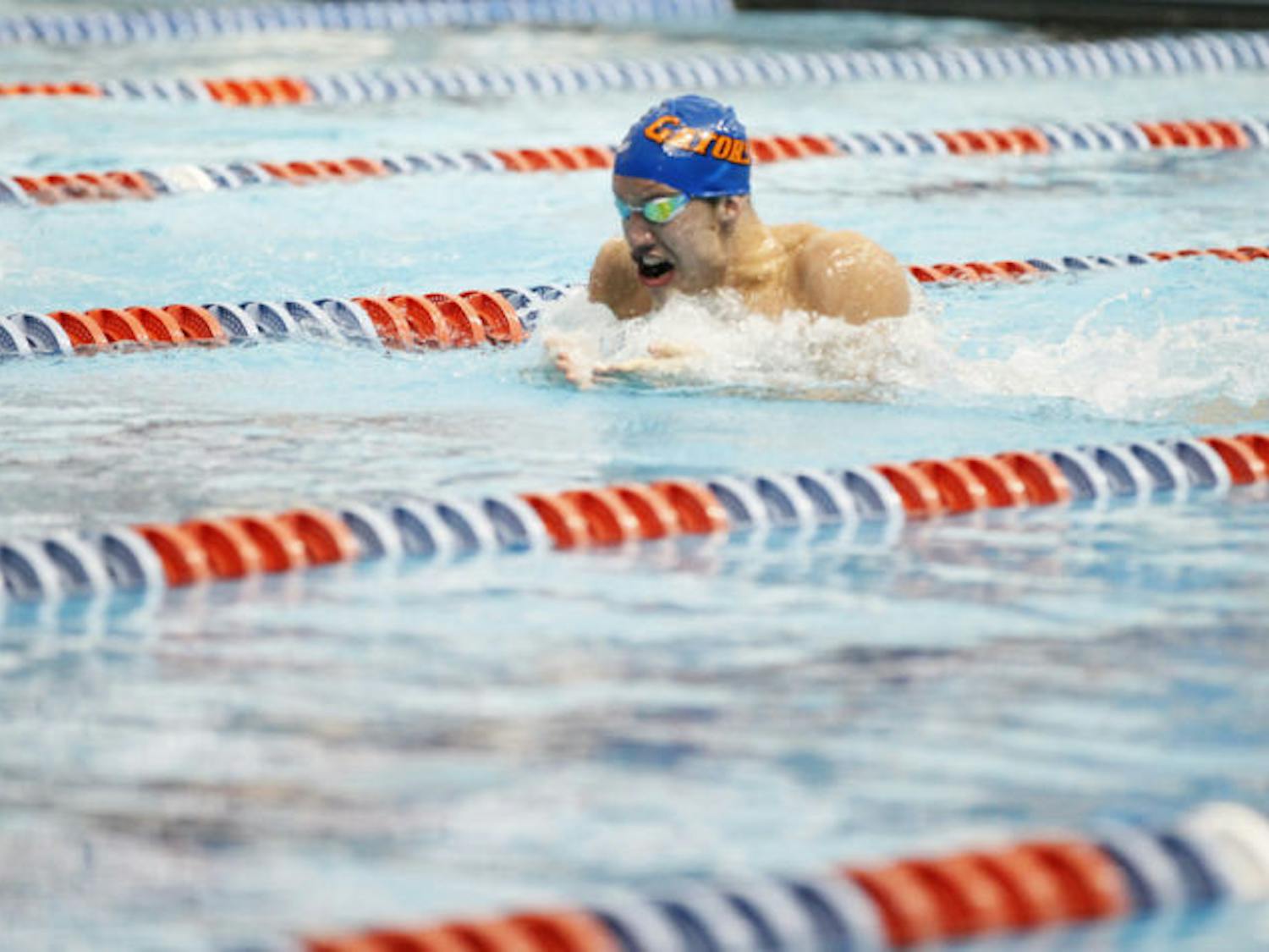 Sophomore Matt Elliott competes in the 100-yard breaststroke against Tennessee on Feb. 1 at the O'Connell Center.