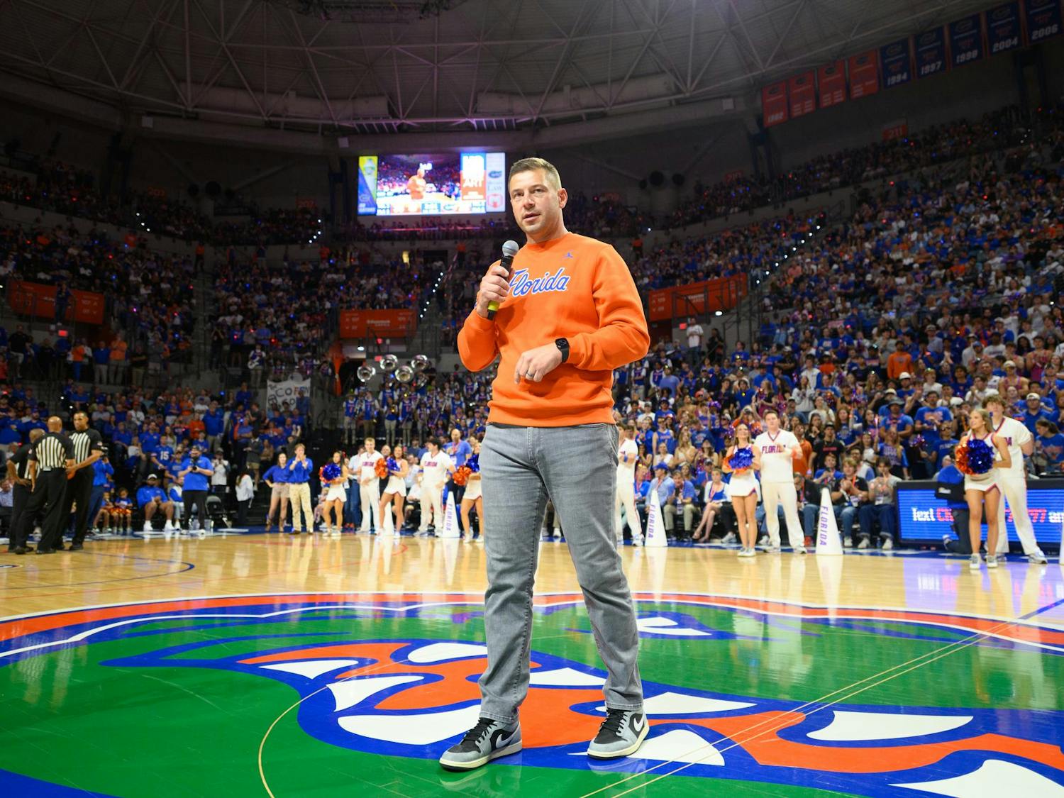 Florida head football coach Jon Sumrall speaks to a crowd of over 11,000 fans during a timeout in an NCAA men’s basketball game between Florida and Auburn in Gainesville, Fla., Saturday, Jan. 24, 2026.