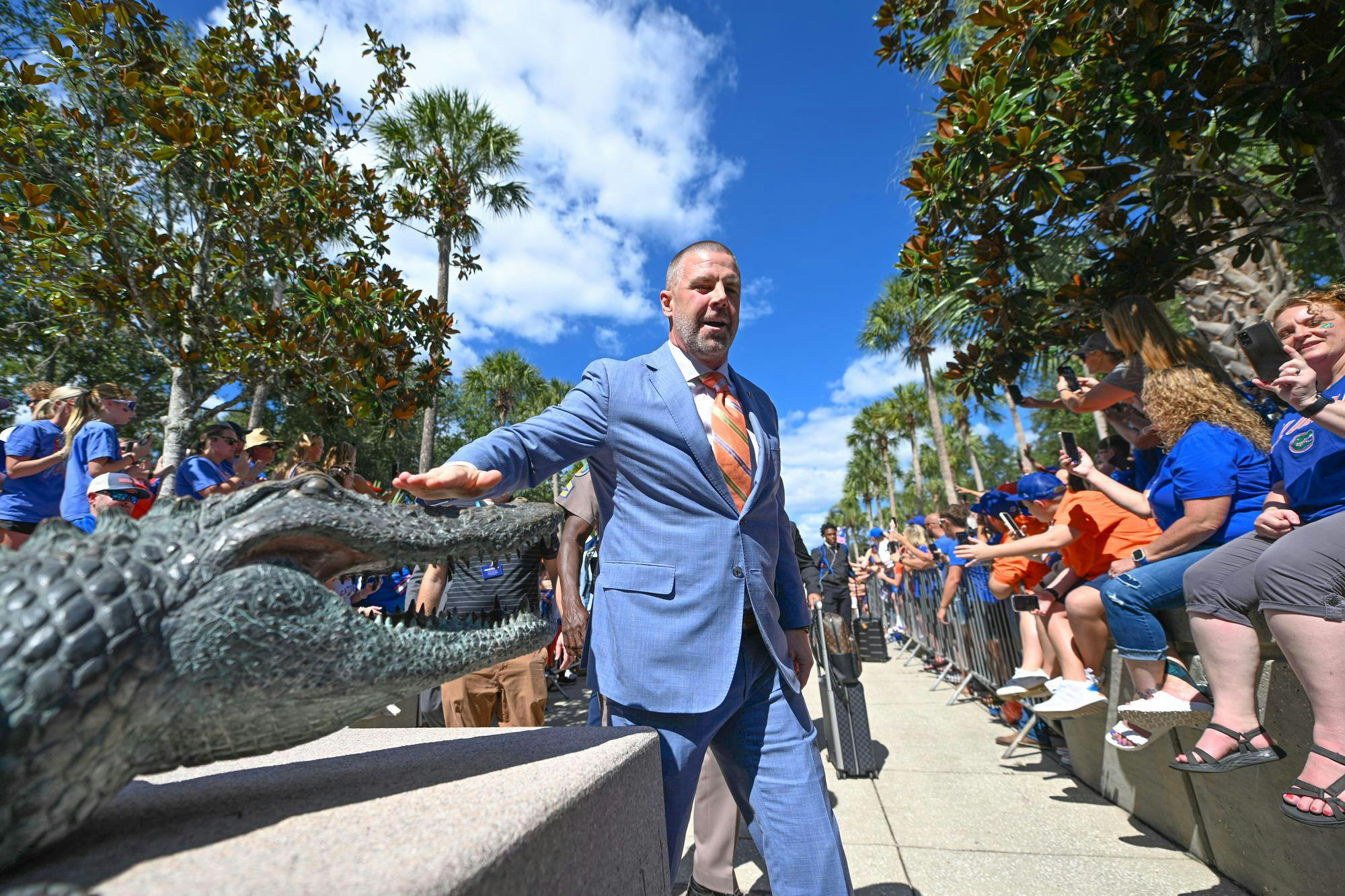 Florida Gators head coach Billy Napier touches the gator statue at Gator Walk before a NCAA college football game, Saturday, Oct. 18, 2025, in Gainesville, Fla.