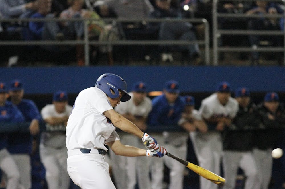 <p>UF outfielder Austin Langworthy connects with a pitch during Florida's 8-1 win over William &amp; Mary on Feb. 18, 2017, at McKethan Stadium.</p>