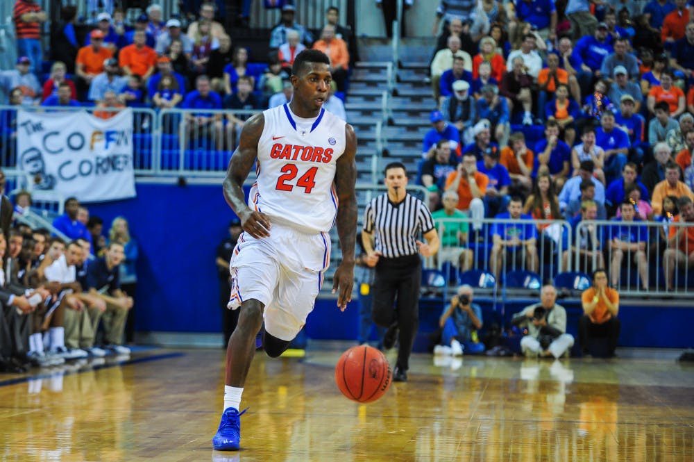 <p>Senior forward Casey Prather dribbles down the court during No. 10 Florida's 77-69 win against North Florida on Friday in the O'Connell Center. Prather scored 28 points and grabbed eight rebounds Friday. </p>