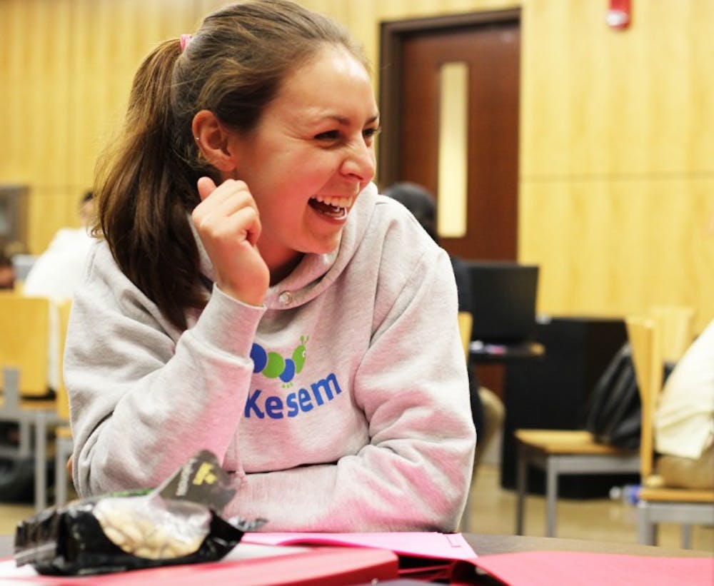 <p>Teal Strammer, a 19-year-old business administration junior, takes a break from studying for Principles of Management by eating pistachios Tuesday night on the second floor of Library West.</p>