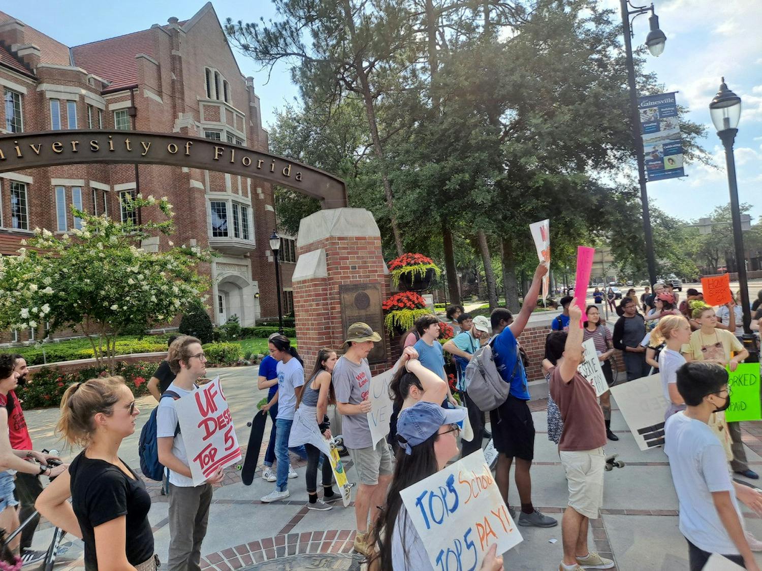 Graduate students protest current wages on the corner of 13th Street and University Avenue May 17, 2022.