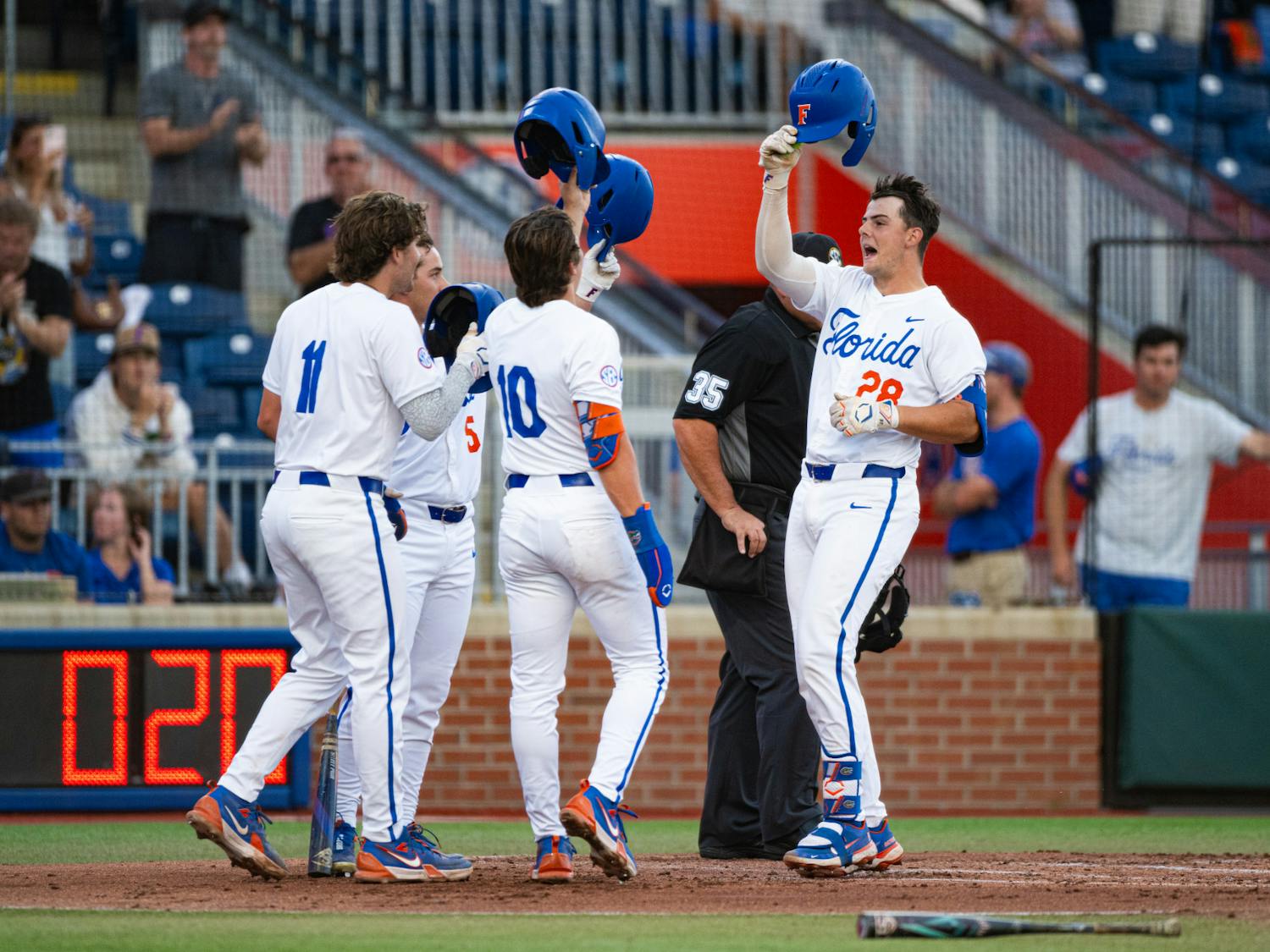 Florida Gators catcher Luke Heyman (28) is congratulated by his teammates after his home run in a baseball game against the Missouri Tigers on Thursday, April 10, 2025, in Gainesville, Fla.