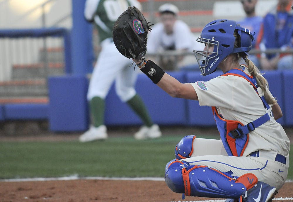 <p>Aubree Munro catches a ball during Florida's doubleheader sweep of Jacksonville on Feb. 17, 2016, at Katie Seashole Pressly Stadium.</p>