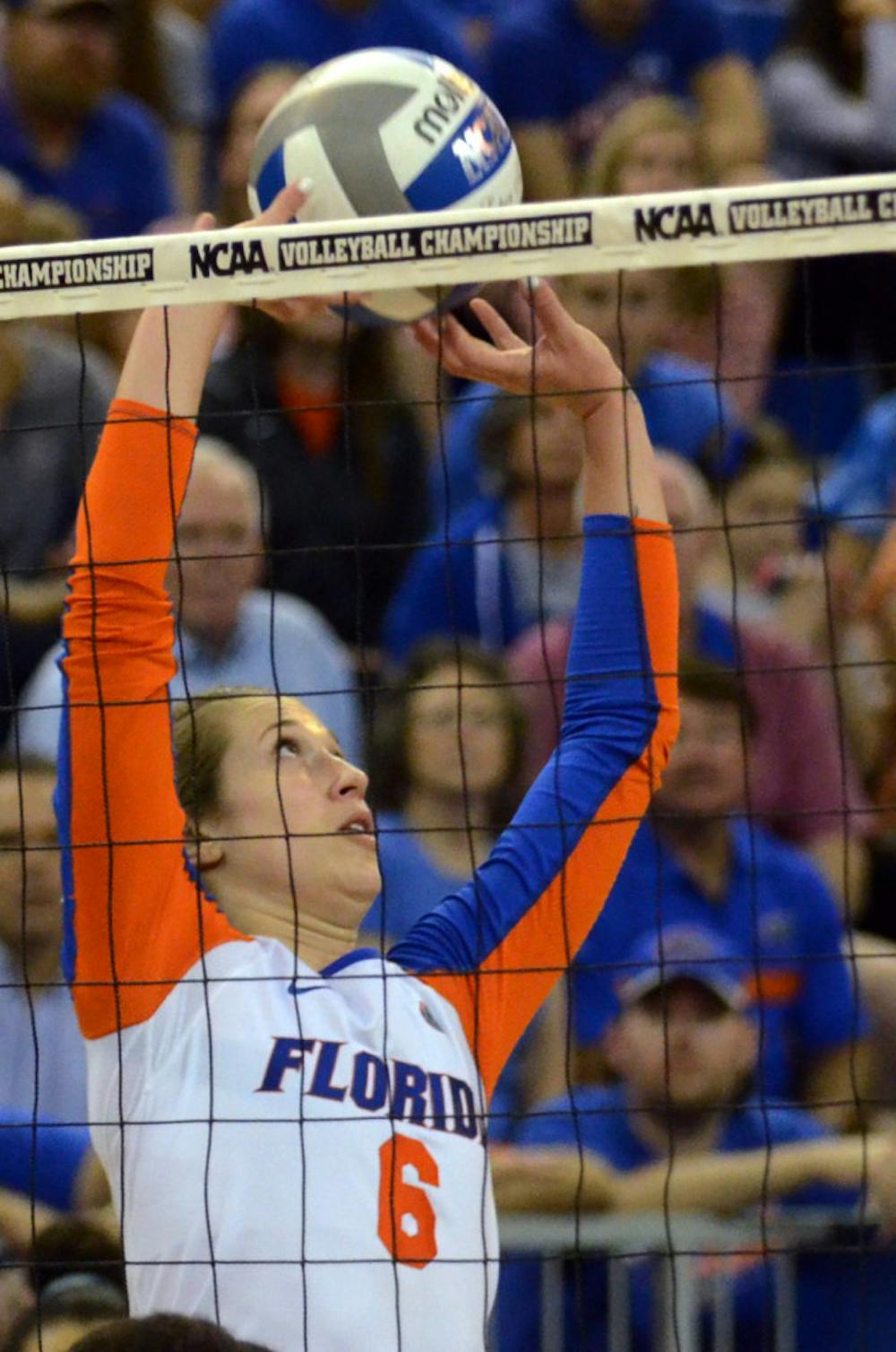 <p>Mackenzie Dagostino sets the ball during No. 8 seed Florida's 3-1 win against Miami in the second round of the NCAA Tournament on Dec. 6, 2014, in the O'Connell Center.</p>