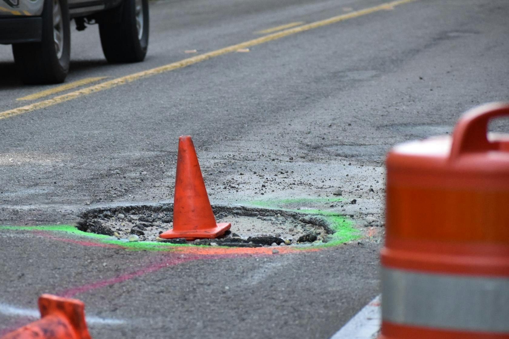 Pothole named "Queen Mary Crater" on CR 346 near River Styx, Friday, Aug 21, 2026, in Gainesville, Fla.