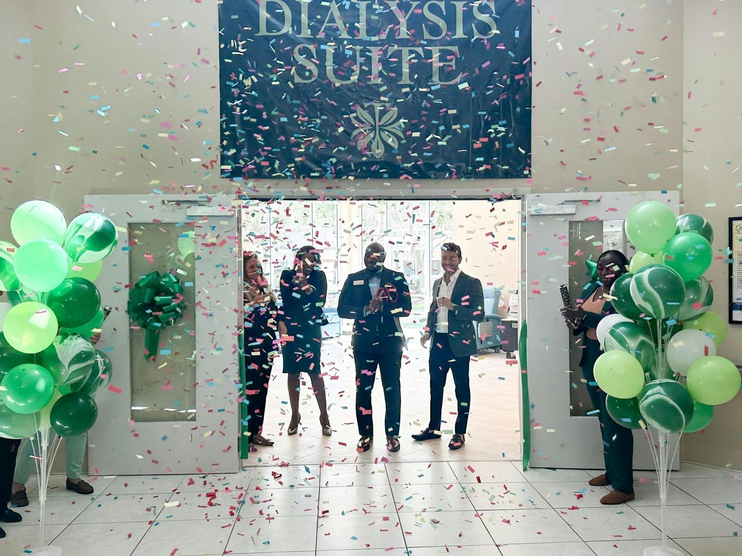 Elizabeth Borer, Lisena Mathurin, Barry Audain, Rob Manela and Jocelyn Middleton celebrate the opening of the dialysis suite with confetti at the ribbon cutting ceremony on Wednesday, May 29, 2024. 
