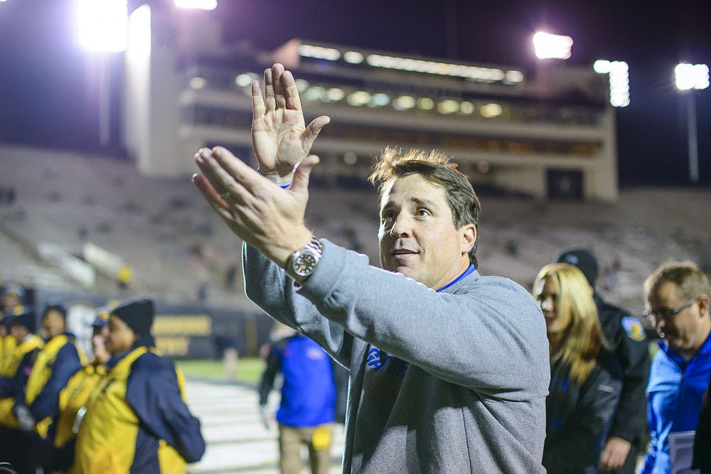 Will Muschamp celebrates following Florida's 34-10 win against Vanderbilt on Saturday.