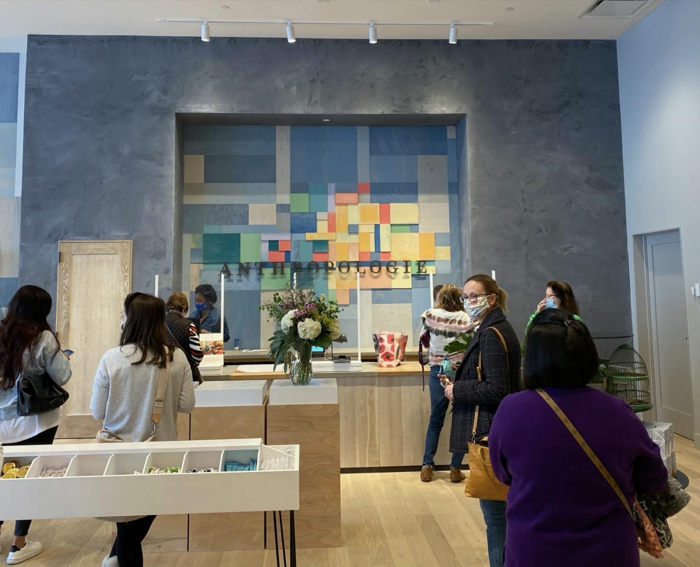 Masked customers shop at the new Gainesville store Wednesday.