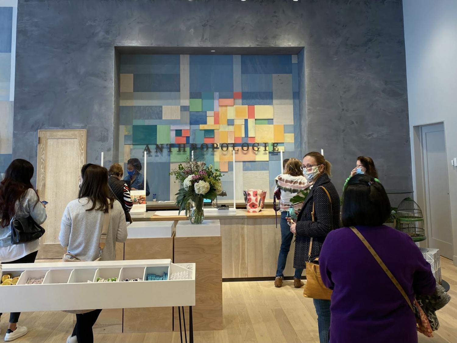 Masked customers shop at the new Gainesville store Wednesday.
