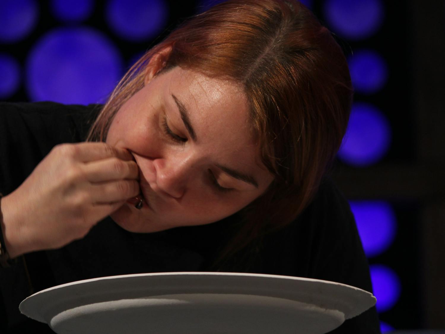 Andrea Reddick, 32, eats a mullet’s eye during an eating contest at the 10 CAN Banquet &amp; Wild Florida Feast on Saturday.