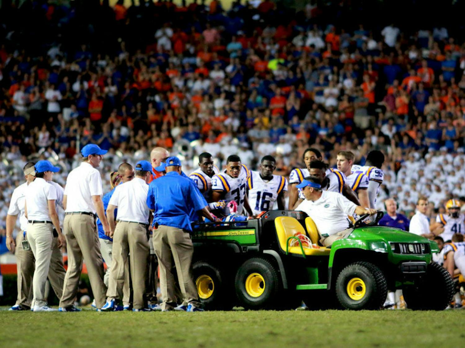 Latroy Pittman is carted off the field following an injury during the fourth quarter of Florida's 30-27 loss to LSU on Saturday at Ben Hill Griffin Stadium.