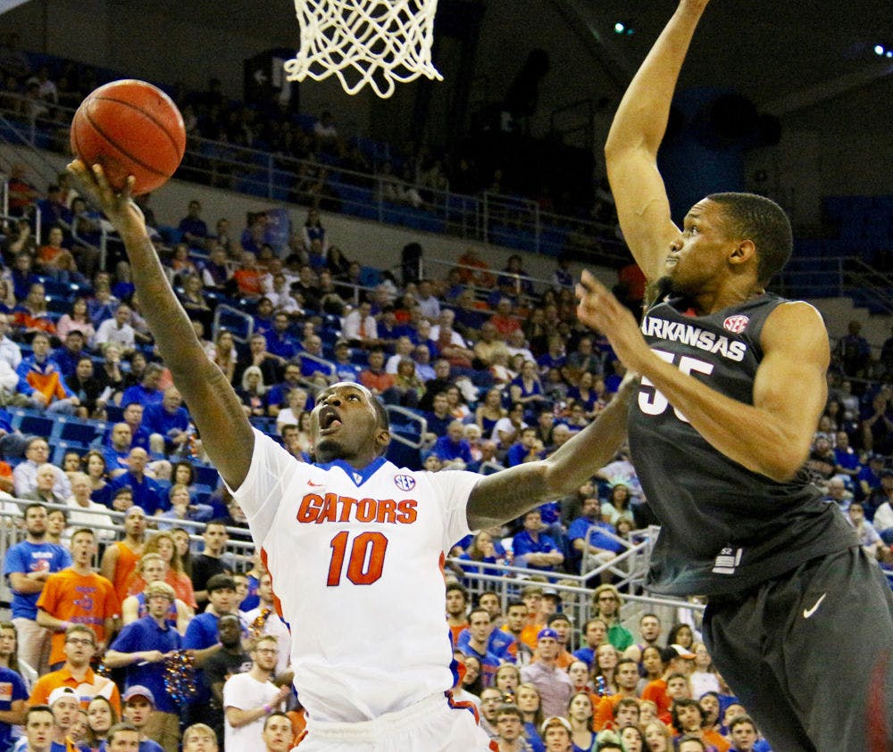 <p>Dorian Finney-Smith goes for a layup during Florida's win against Arkansas on Jan. 30, 2016, in the O'Connell Center.</p>