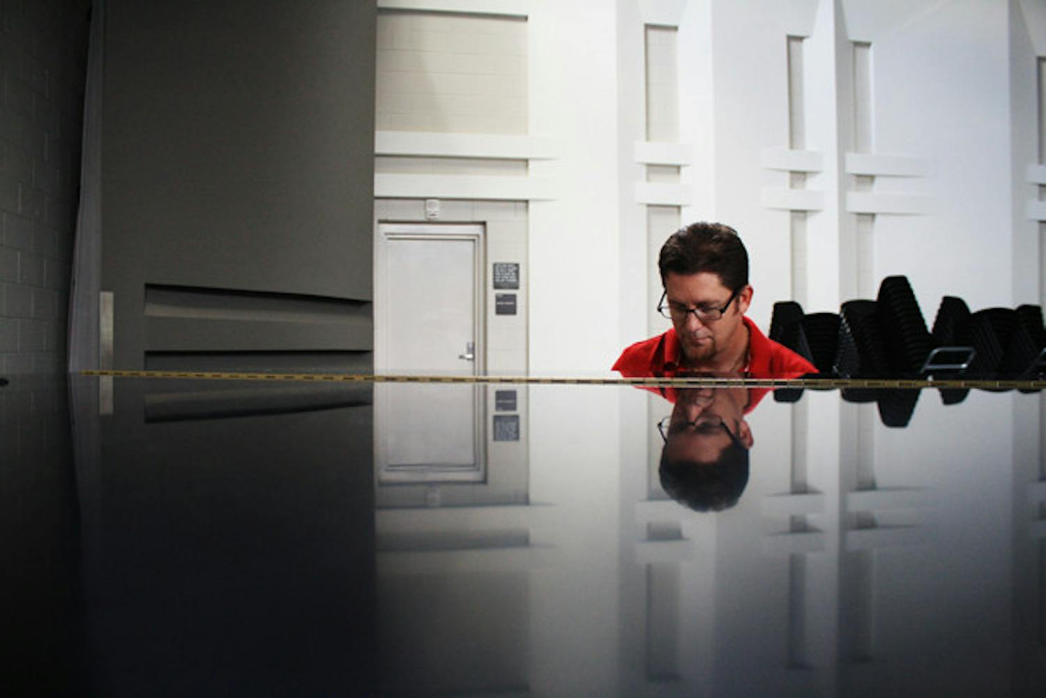 UF jazz professor Scott Wilson poses as he plays the piano inside the Steinbrenner Band Building Sunday afternoon. Wilson released an Earth, Wind and Fire tribute album on Grooveshark.
