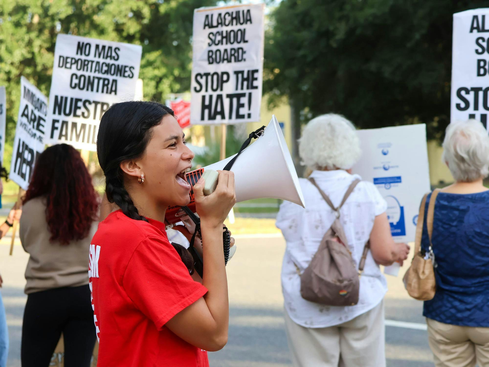 A protester leads a chant at an ICE Protest held at the Alachua County Public Schools District Office in downtown Gainesville on Tuesday, Sept. 16, 2025.
