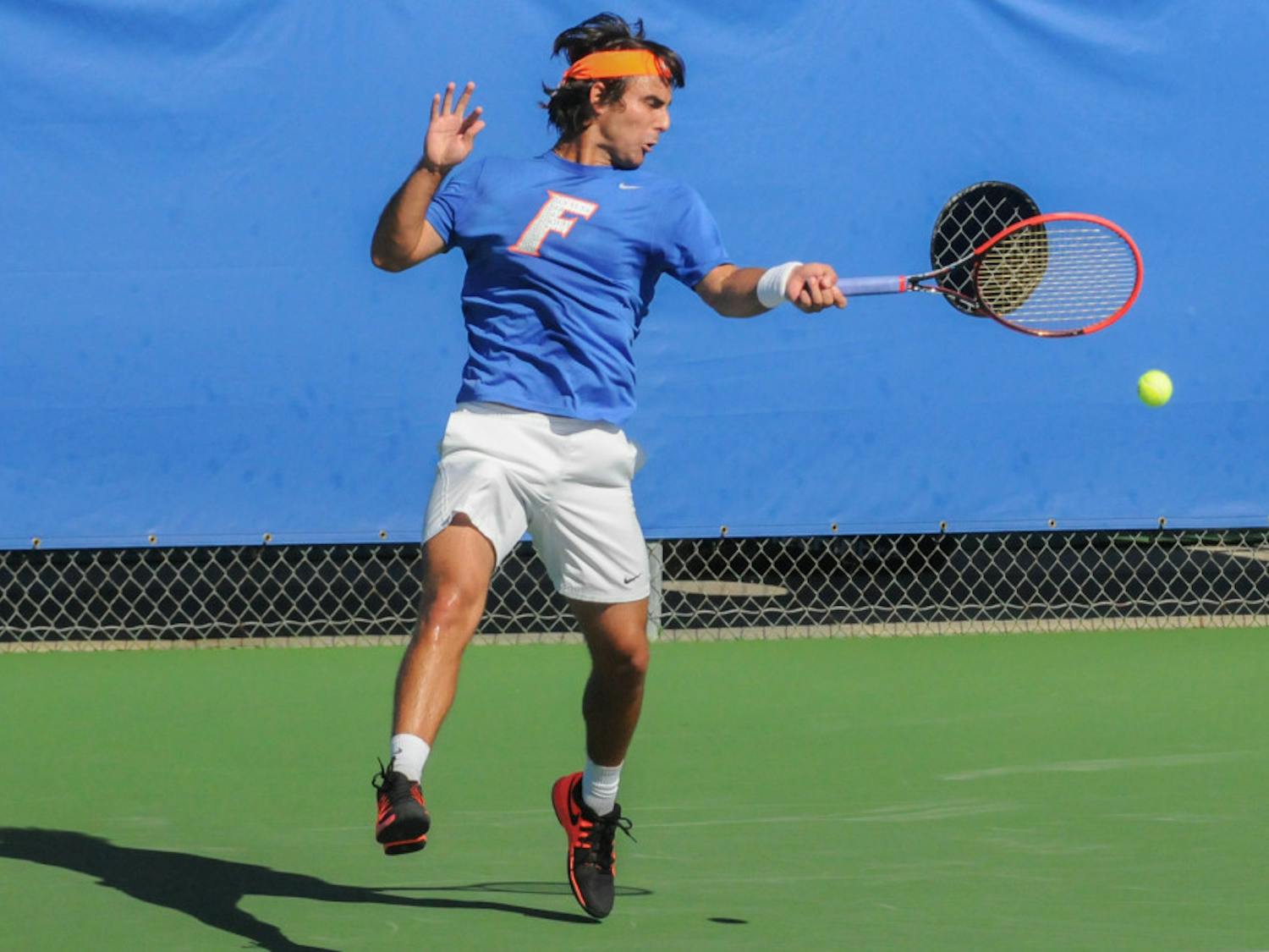 Diego Hidalgo returns a serve during Florida's 6-1 win over Troy on Jan. 17, 2016, at the Ring Tennis Complex.