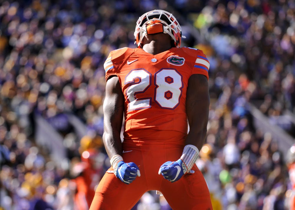 <p>Florida linebacker Kylan Johnson celebrates during UF's 16-10 win over LSU on Nov. 19, 2016.</p>