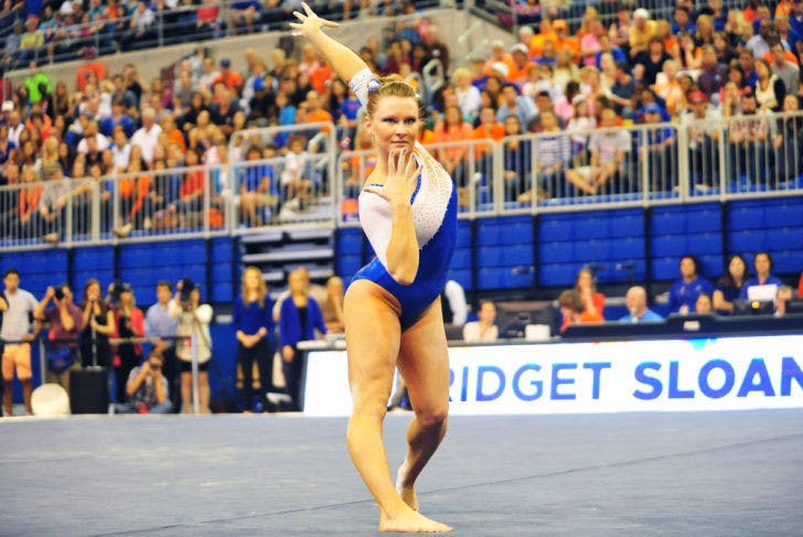 Bridget Sloan performs her floor routine during Florida’s 198.1-196.85 win against Alabama on Feb. 8 in the O’Connell Center. Sloan won uneven bars (9.95) and all-around (39.675) against the Crimson Tide.