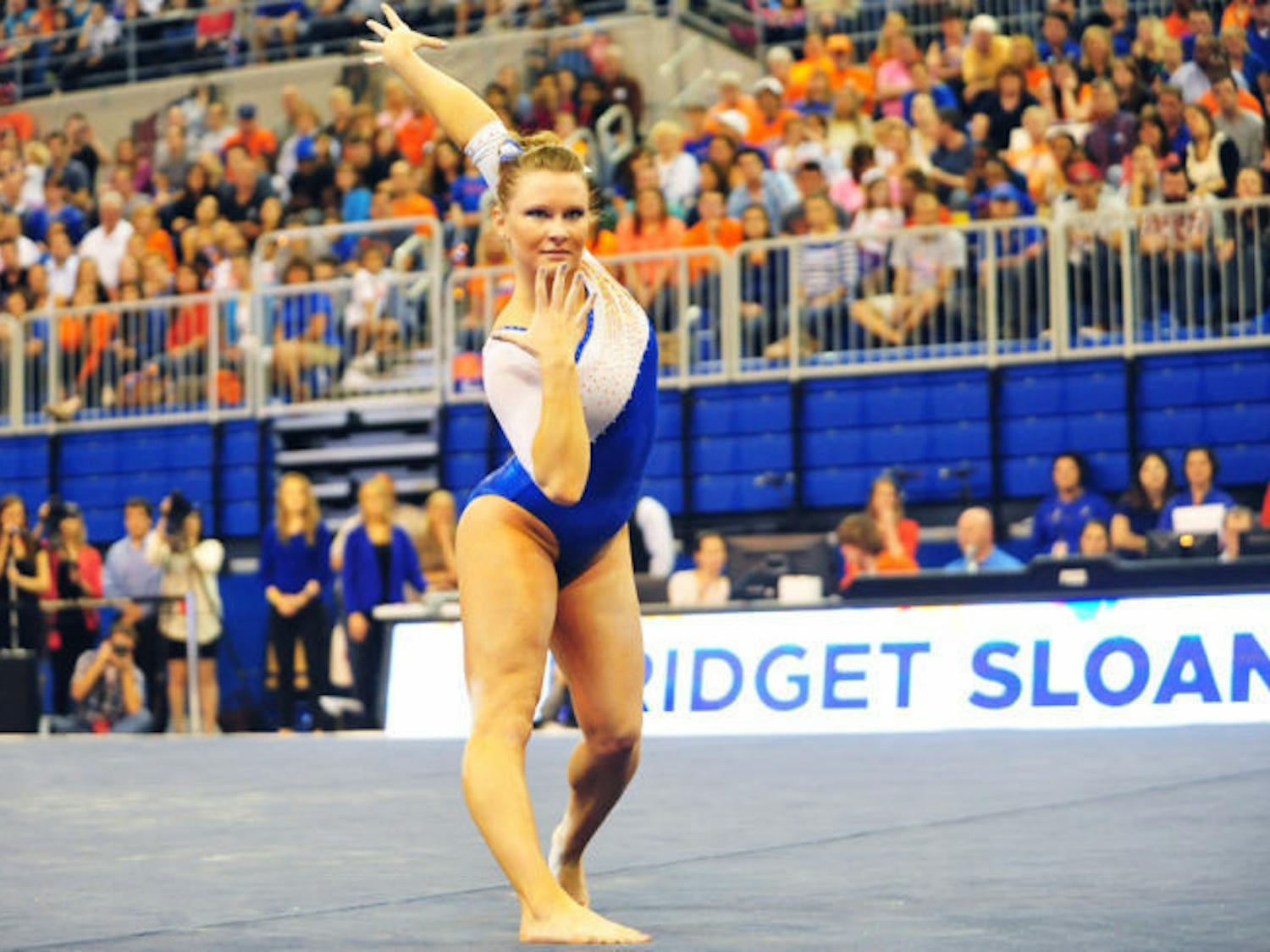 Bridget Sloan performs her floor routine during Florida’s 198.1-196.85 win against Alabama on Feb. 8 in the O’Connell Center. Sloan won uneven bars (9.95) and all-around (39.675) against the Crimson Tide.