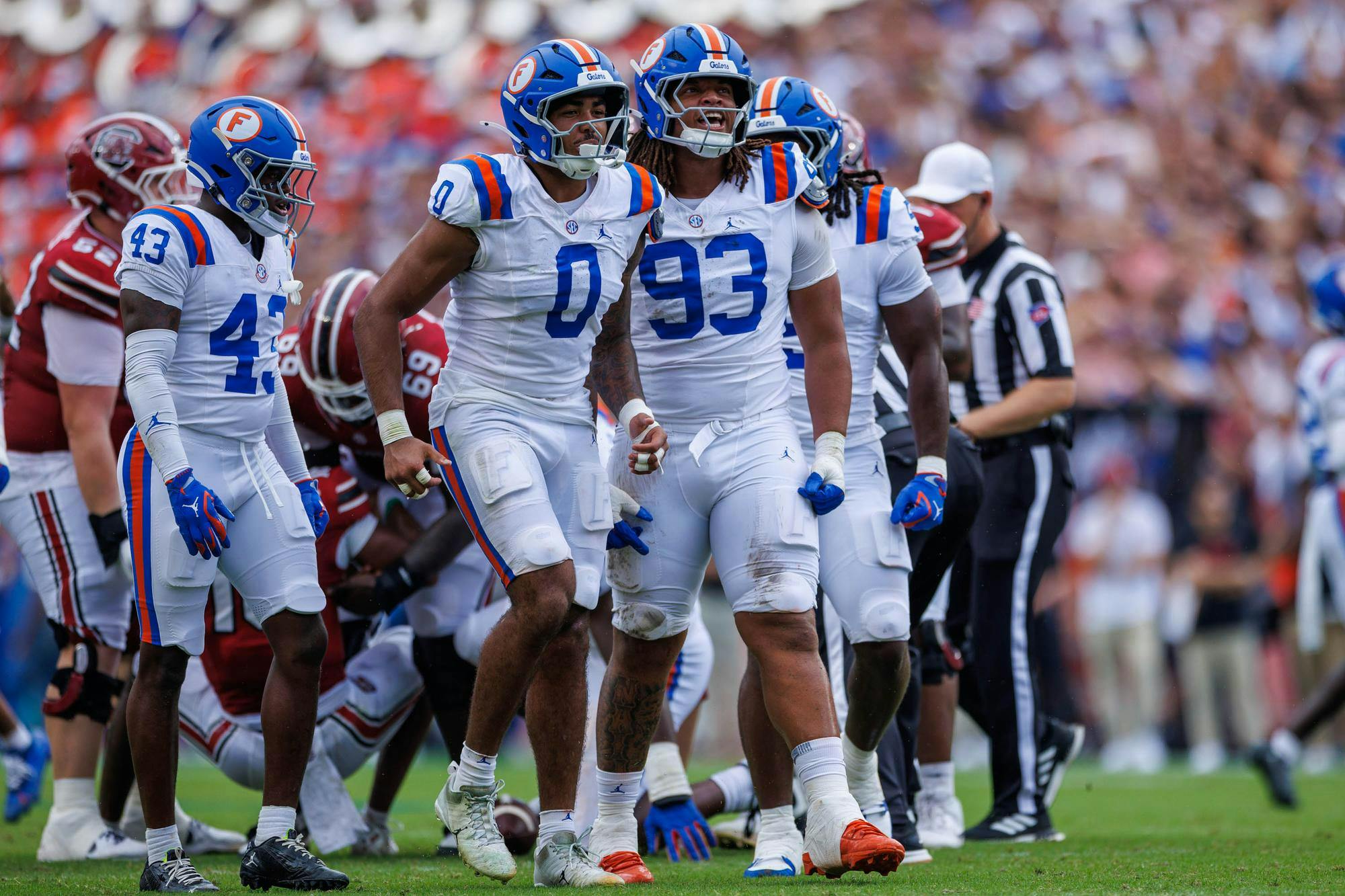 Florida linebacker Jayden Woods (0) and defensive lineman DK Kalu (93) celebrate during the first half of an NCAA college football game against South Carolina, Saturday, Oct. 10, 2026, in Gainesville, Fla.