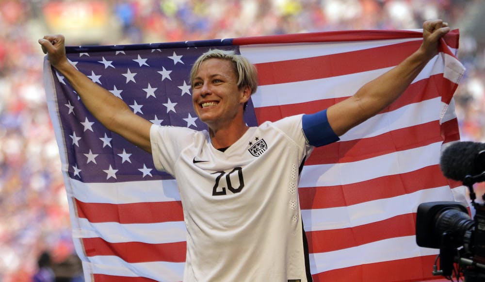 <p>In this July 5, 2015, file photo, United States' Abby Wambach holds an American flag after the U.S. beat Japan 5-2 in the FIFA Women's World Cup soccer championship in Vancouver, British Columbia, Canada. Wambach, the leading career scorer, male or female, in international soccer, announced her retirement from soccer on Tuesday, Oct. 27, 2015, shortly after the U.S. national team celebrated its Women's World Cup victory at the White House. (AP Photo/Elaine Thompson, File_</p>