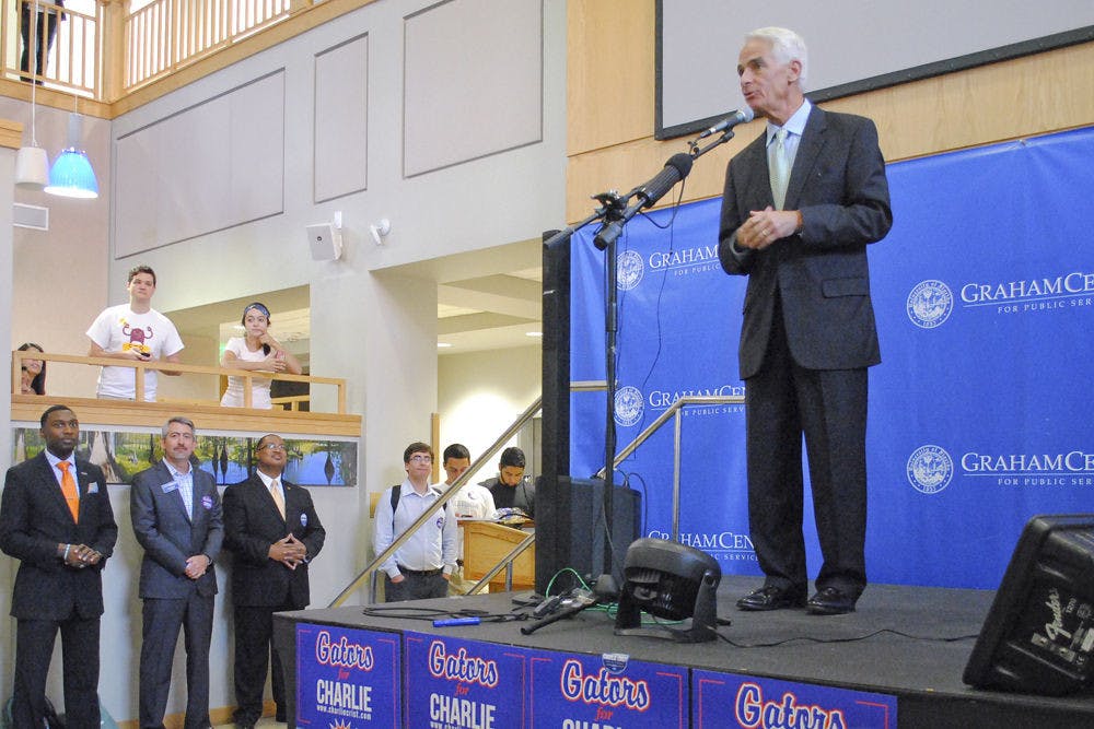 Democratic gubernatorial candidate Charlie Crist speaks with his fan at Pugh Hall Ocora on Wednesday afternoon to encourage students to vote in the upcoming election.