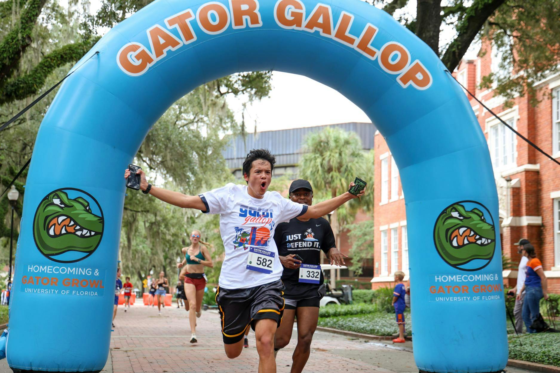 Participants of the 2026 Gator Gallop cross the finish line on Gainesville’s Plaza of the Americas. The Gator Gallop kicked off UF’s Homecoming Weekend Friday, Oct. 9, 2026.